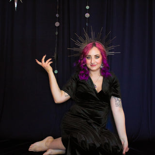Artist Nicole in a moody, mystical setting reflecting the energy behind Starwitch Metals jewelry.